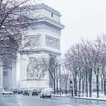 cars parked on sidewalk near building during daytime